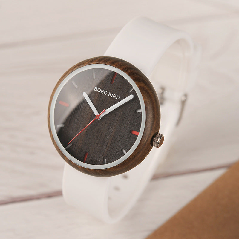 Young female student with new wooden watch